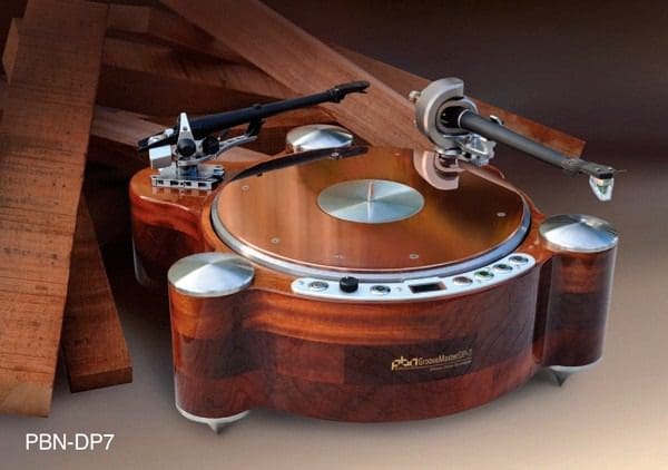 A wooden turntable with some metal parts on it