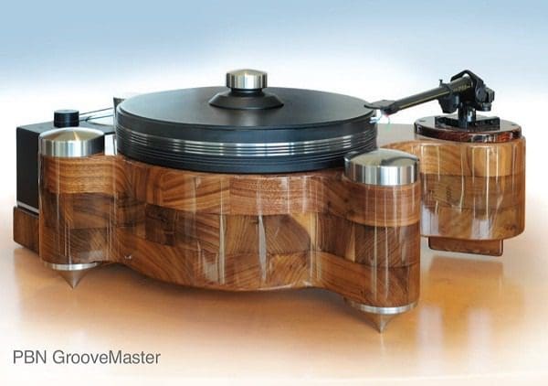A wooden turntable with two silver knobs on top.
