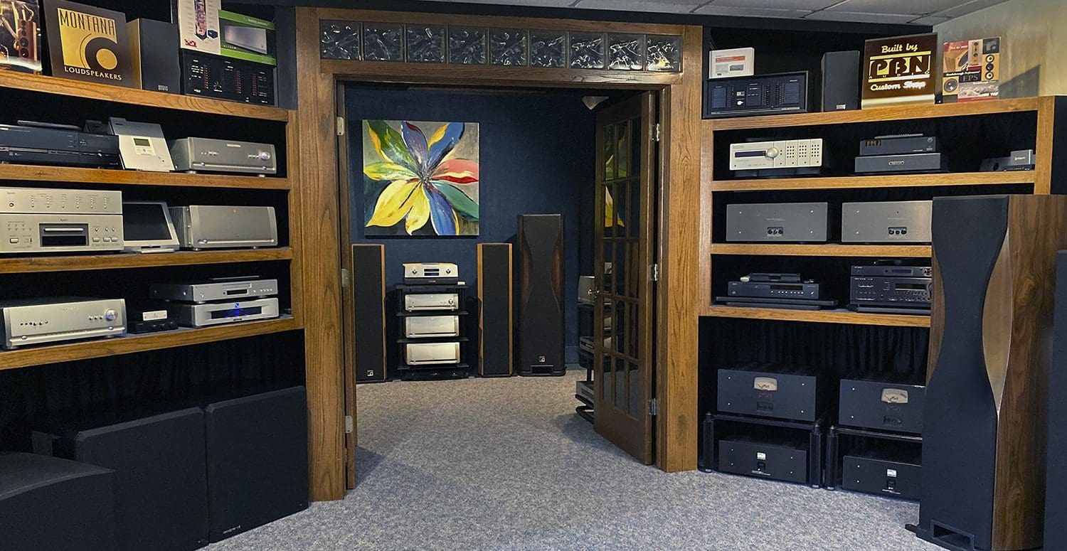 A room with many different types of speakers.
