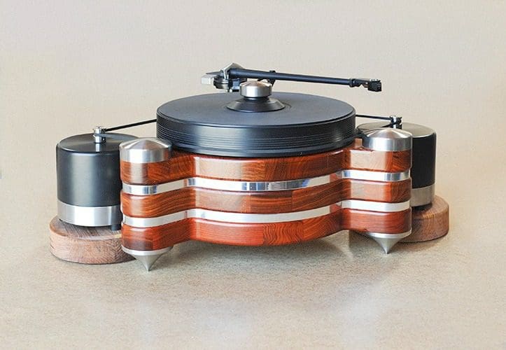 A wooden and metal turntable with two speakers.
